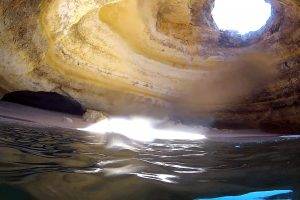 Cave In Middle of Beach Water Photo