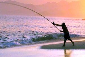 Fishing at Beach Sunset