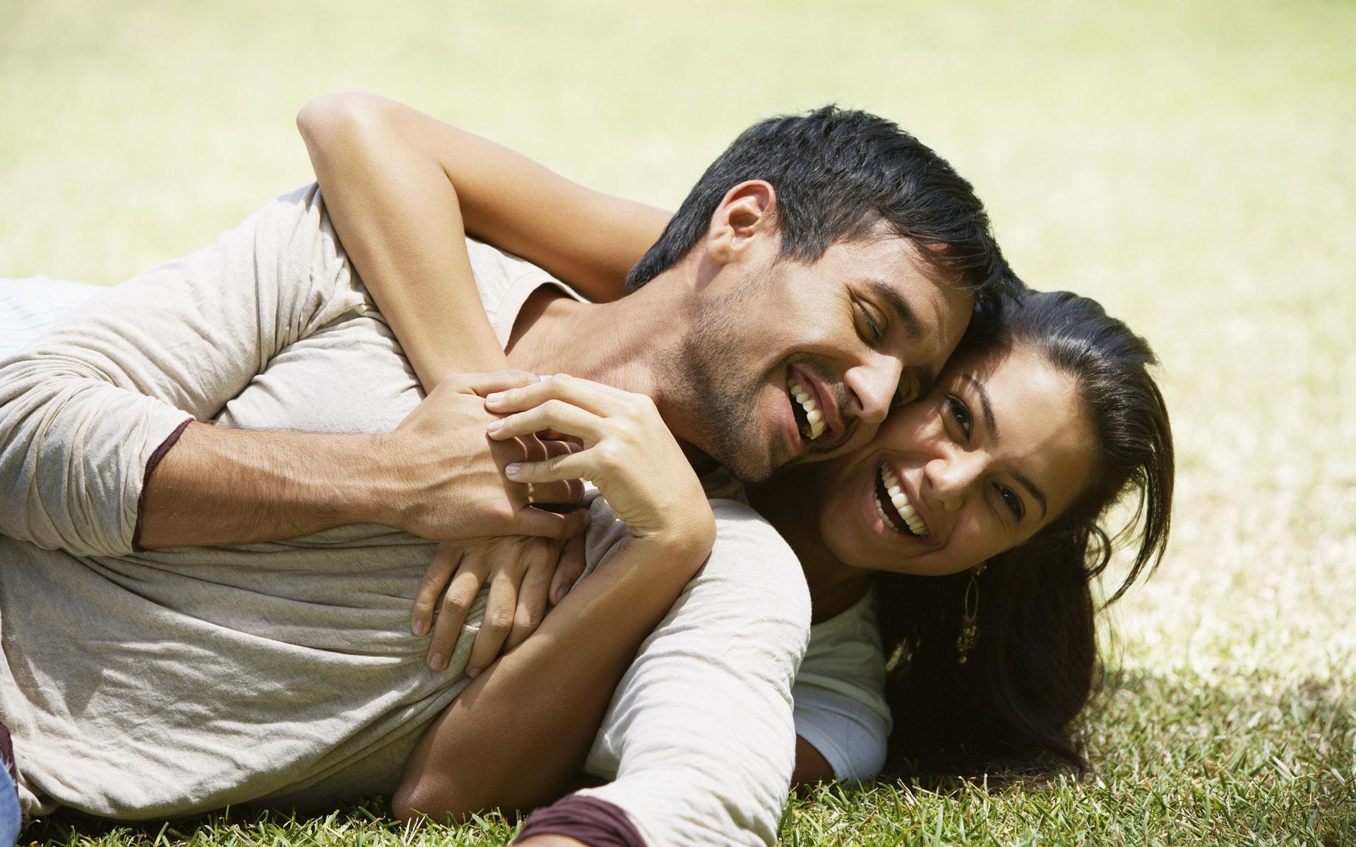 Happy Couple on Grass Wallpaper