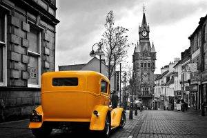 Vintage Yellow Car In A Gray City