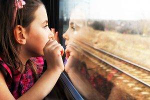 Little Girl Reflection On The Window