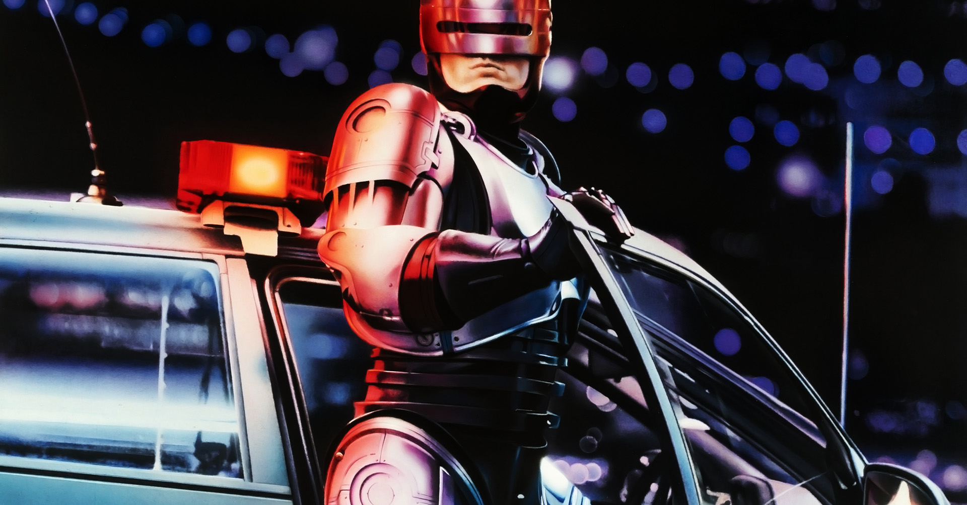 Robocop With Police Car Wallpaper