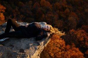 women, Model, Blonde, Long Hair, Women Outdoors, Nature, Trees, Lying On Back, Looking At Viewer, Black Clothing, Open Mouth, Rock, Forest, Windy, Sneakers, Adidas, Skinny Jeans, Fall, Blue Eyes
