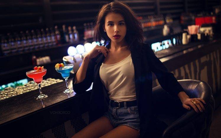 women, Model, Brunette, Long Hair, Bar, Ivan Gorokhov, Tank Top, Suits, Jean Shorts, Looking At Viewer, Drinking Glass, Drink, Sitting, Open Mouth, Chair, Bottles, Alcohol, Red Lipstick, Lens Flare, Brown Eyes HD Wallpaper Desktop Background