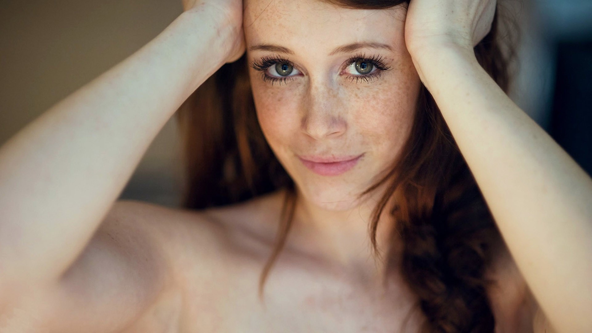 women, Model, Redhead, Long Hair, Looking At Viewer, Face, Portrait, Charlotte Herbert, Chad Suicide, Depth Of Field, Blue Eyes, Smiling, Hands On Head, Freckles, Bare Shoulders Wallpaper