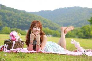 women, Model, Redhead, Long Hair, Women Outdoors, Depth Of Field, Looking At Viewer, Smiling, Asian, Lying On Front, Dress, Barefoot, Legs Up, Picnic, Flowers, Nature, Field, Grass, Hill, Trees, Forest, High Heels