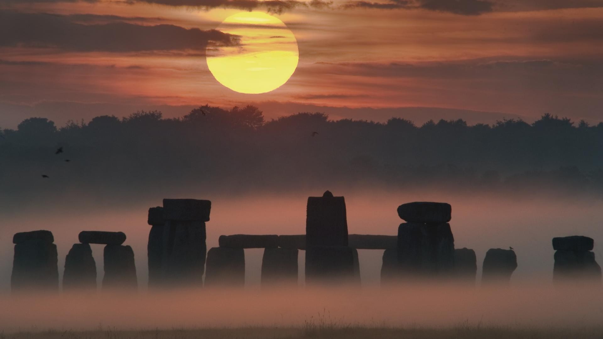 architecture, Nature, Trees, Sun, Pillar, Stone, Stonehenge, England, UK, Mist, Forest, Clouds, Morning, Sunrise, Birds, Field, Grass Wallpaper