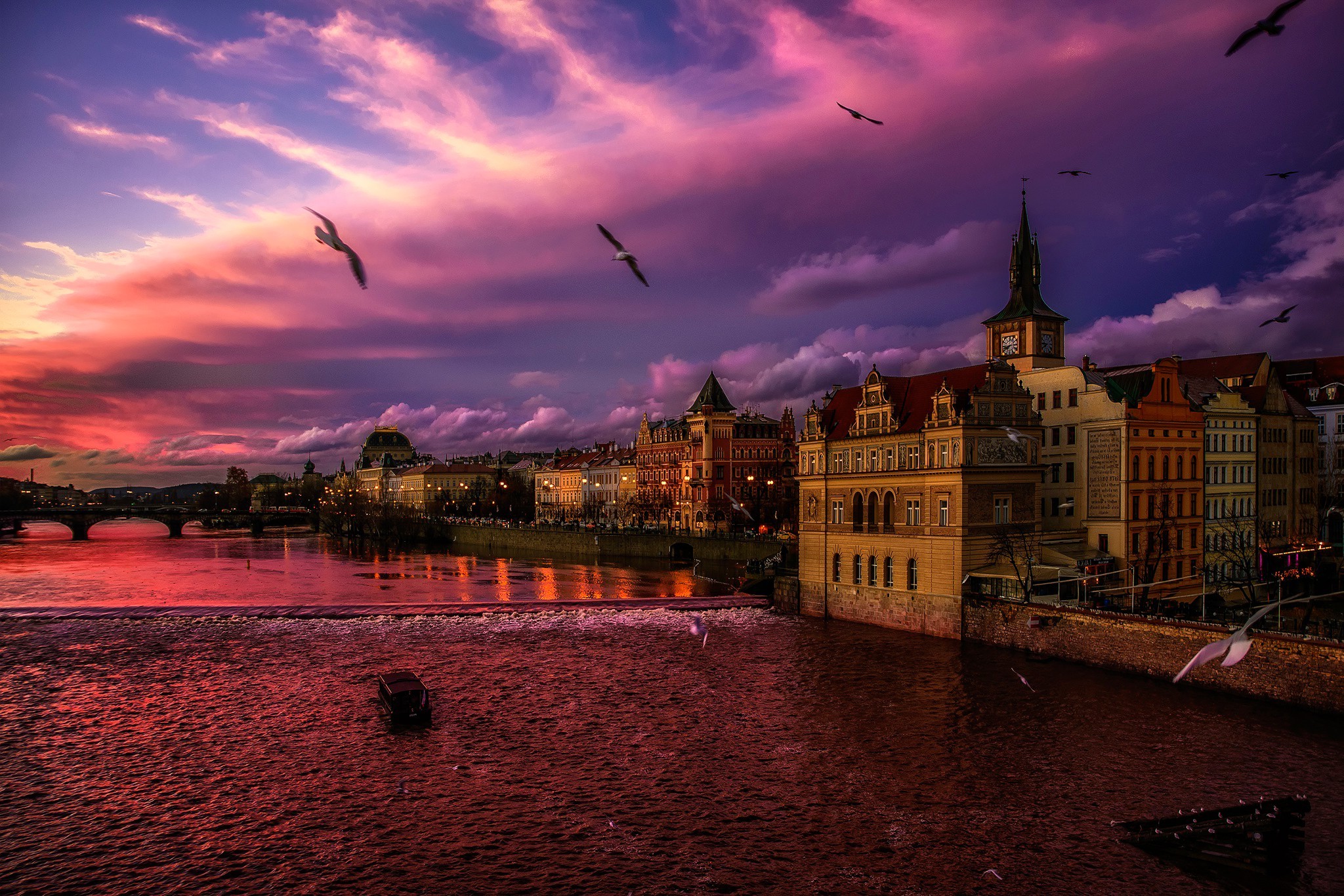 city, Cityscape, Lights, Evening, Prague, Czech Republic, River, Bridge, Sunset, Birds, Waves, Old Building, Church, Clouds, Reflection Wallpaper