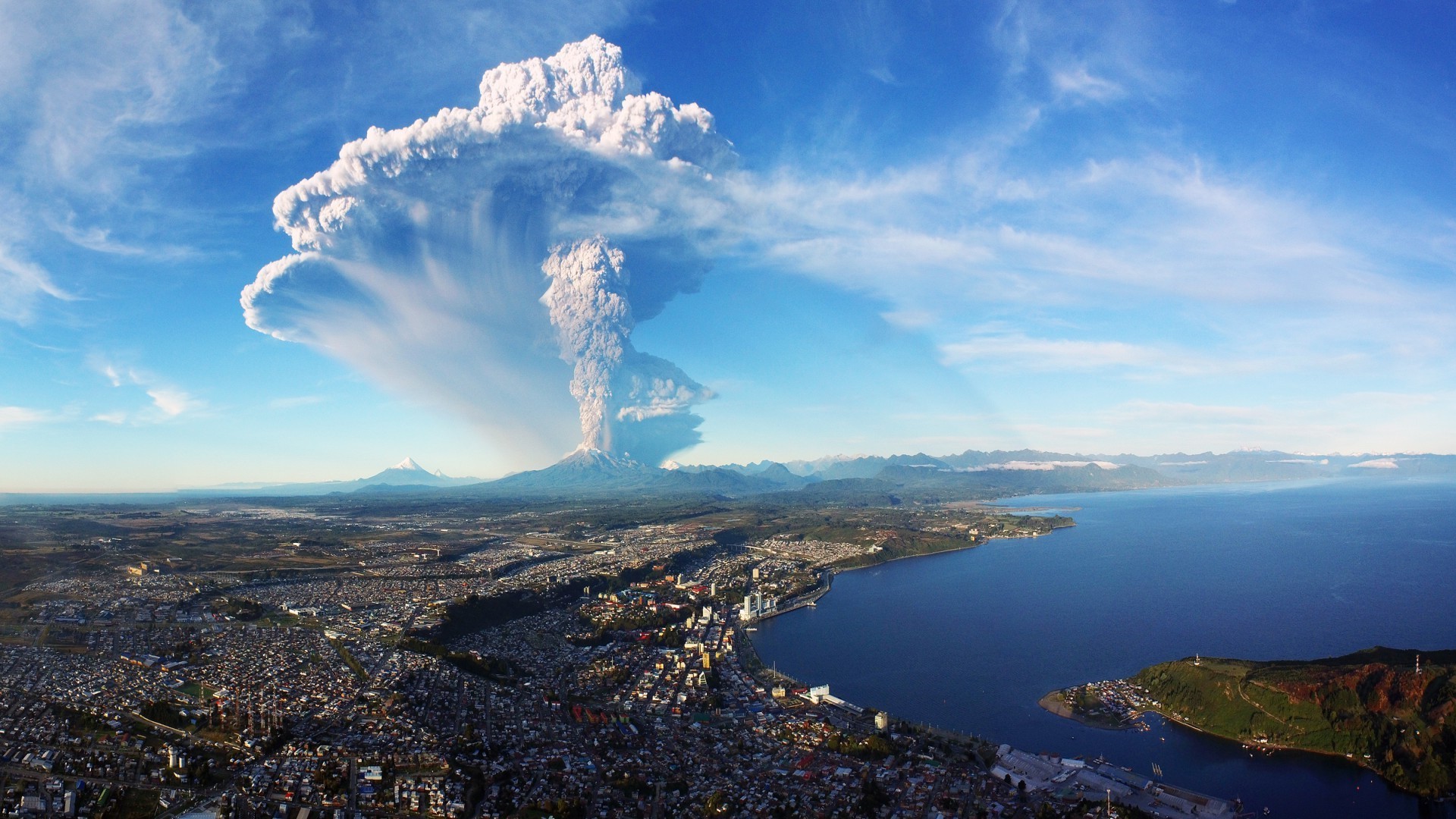cityscape, City, Building, Chile, Nature, Volcano, Eruption, Smoke, Mountain, Snowy Peak, Water, Sea, Hill, House, Clouds, Birds Eye View, Aerial View, Coast Wallpaper