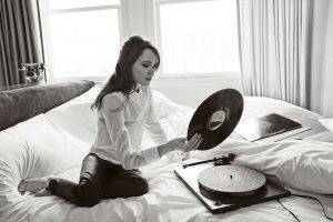women, Actress, Brunette, Long Hair, Sitting, Ellen Page, In Bed, Barefoot, Monochrome, Blouses, Vinyl, Gramophone, Leather Pants, Telephone, Curtain
