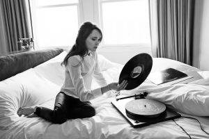 women, Actress, Brunette, Long Hair, Sitting, Ellen Page, In Bed, Barefoot, Monochrome, Blouses, Vinyl, Gramophone, Leather Pants, Telephone, Curtain