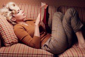 Michelle Williams, Lying Down, Curly Hair, Blonde, Women, Lying On Back, Women Indoors, Legs  Crossed, Long Hair, Books, Couch, Sweater, Pants, Reading