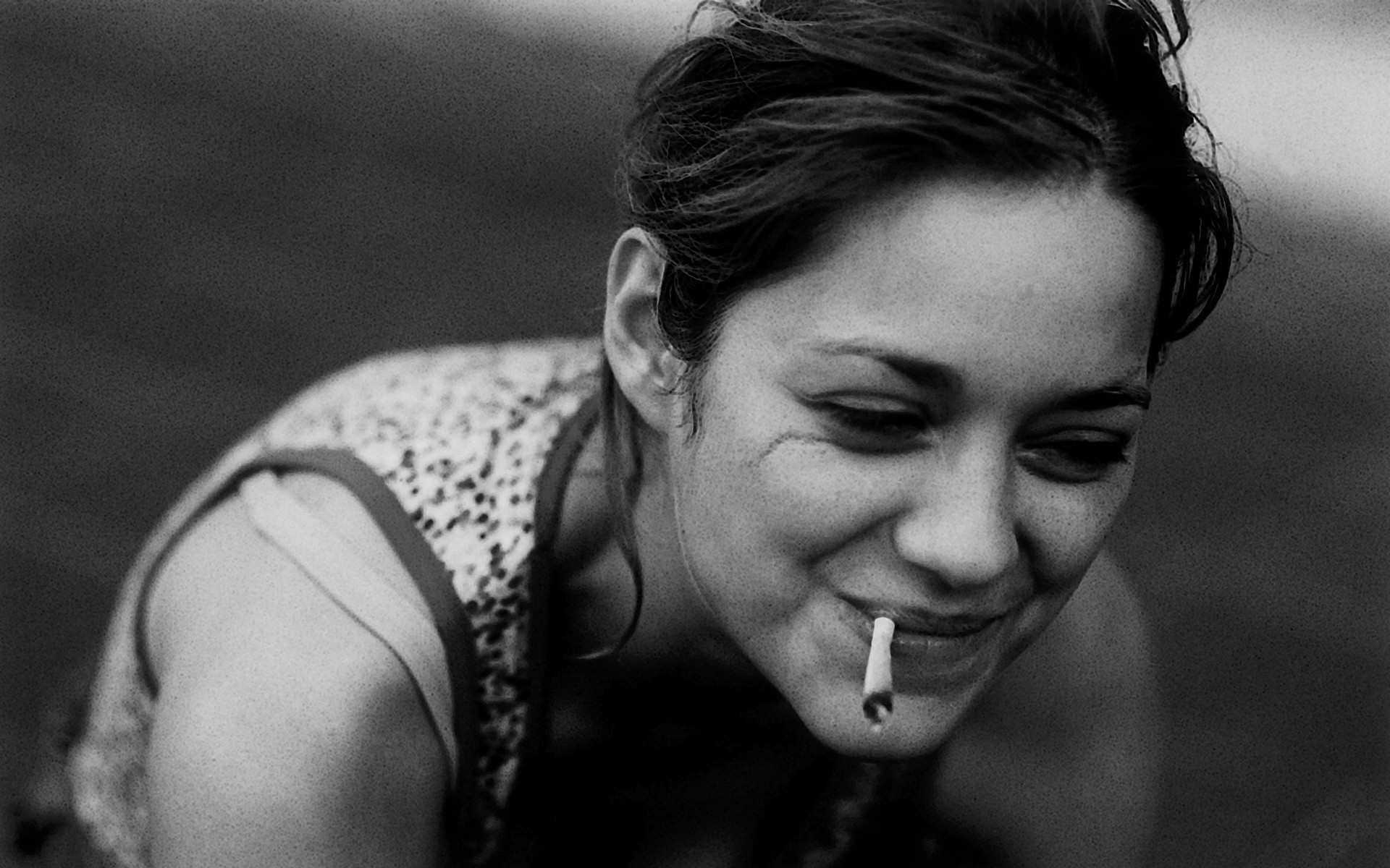 Marion Cotillard smoking a cigarette (or weed)
