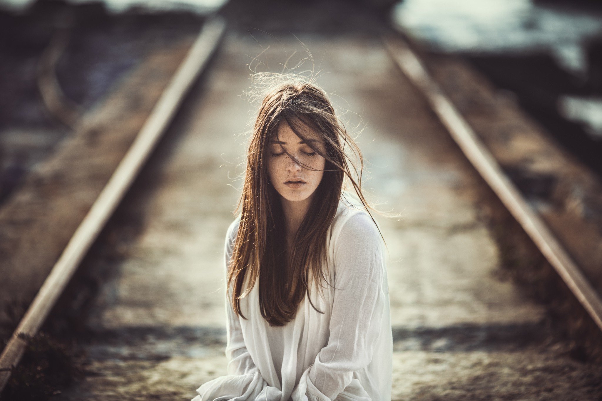 women, Brunette, Closed Eyes, Face, Freckles, Women Outdoors, White Clothing, Portrait, Railway, Depth Of Field, Windy, Emotions Wallpaper