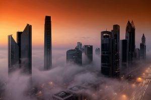 cityscape city architecture skyscraper building birds eye view dubai united arab emirates mist sunset street lights modern orange
