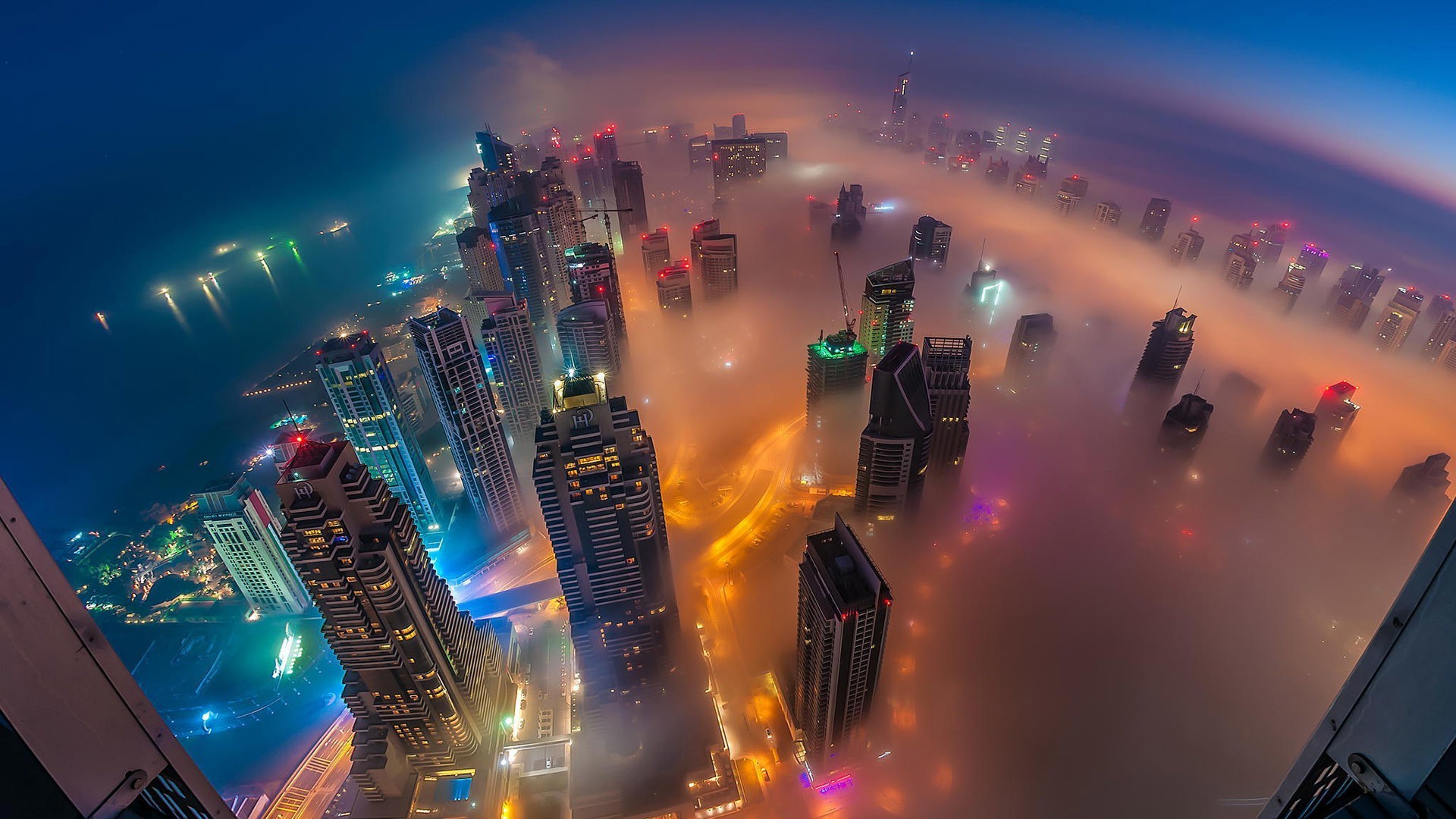 cityscape city architecture building skyscraper night lights birds eye view street dubai united arab emirates mist sea cranes machine bay mountain Wallpaper