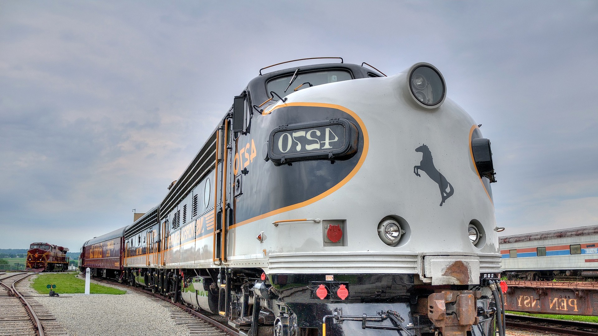 railway train vehicle pennsylvania usa diesel locomotives clouds horse rail yard Wallpaper