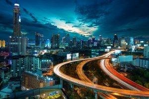 cityscape city architecture night building skyscraper lights street light clouds bangkok light trails trees water billboards birds eye view road