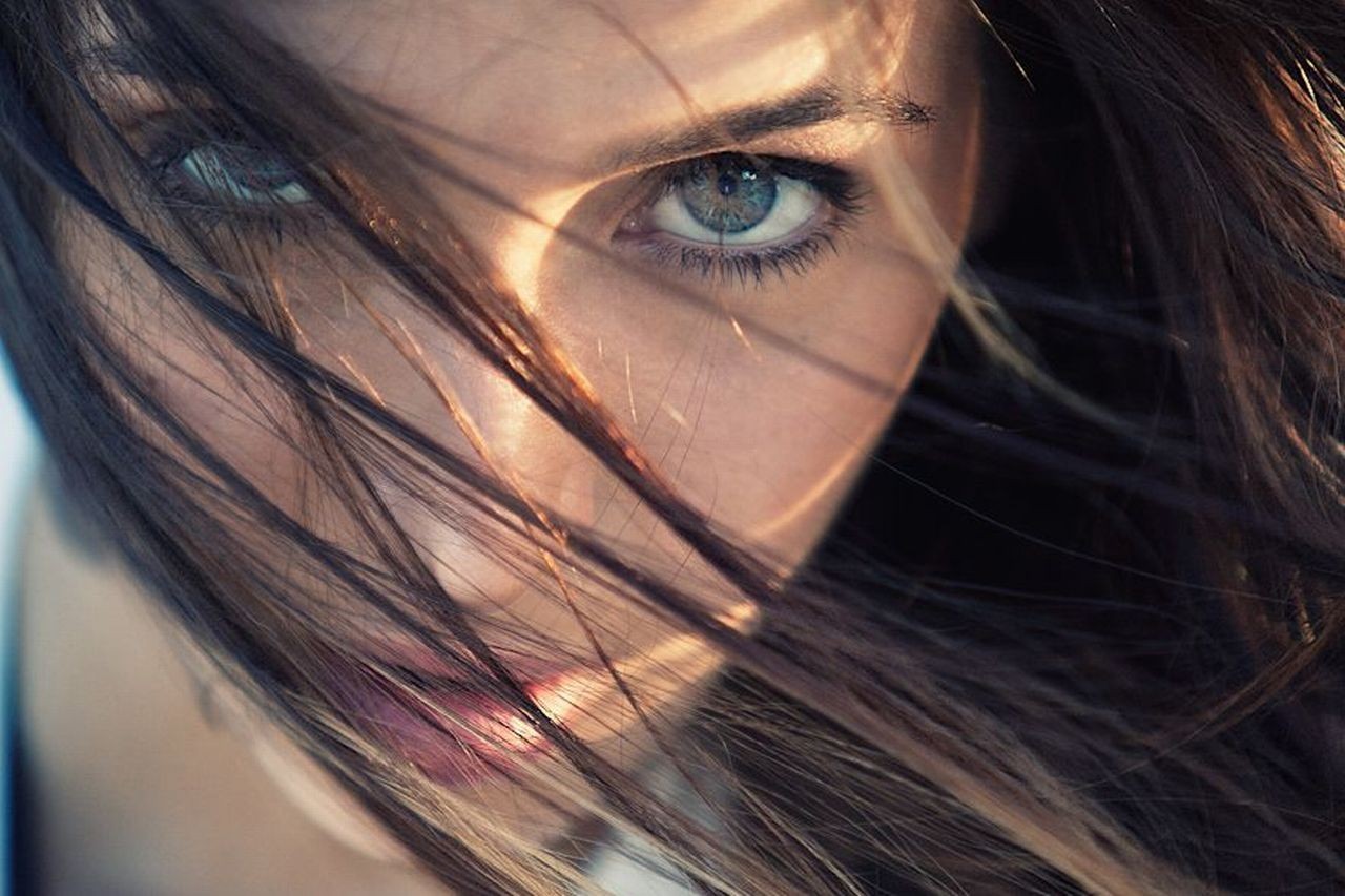 women face brunette hair in face blue eyes Wallpaper