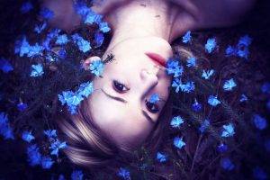 women upside down blue flowers