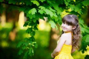 children leaves yellow dress bangs smiling