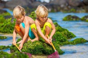 children fishing depth of field moss blonde crouching water