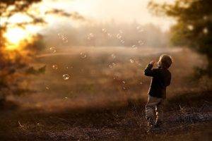 children bubbles depth of field nature sunlight