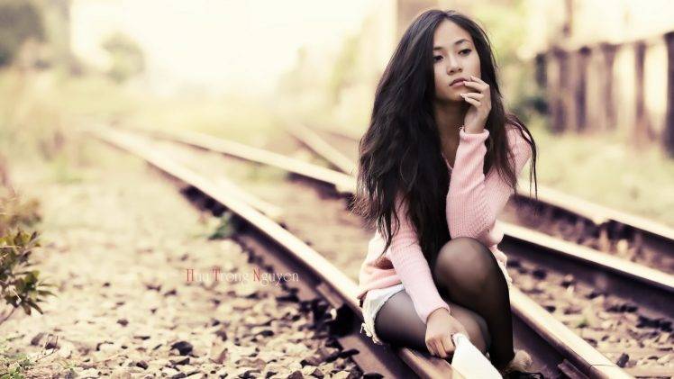 women model brunette long hair asian women outdoors jean shorts stockings sitting sweater railway depth of field HD Wallpaper Desktop Background