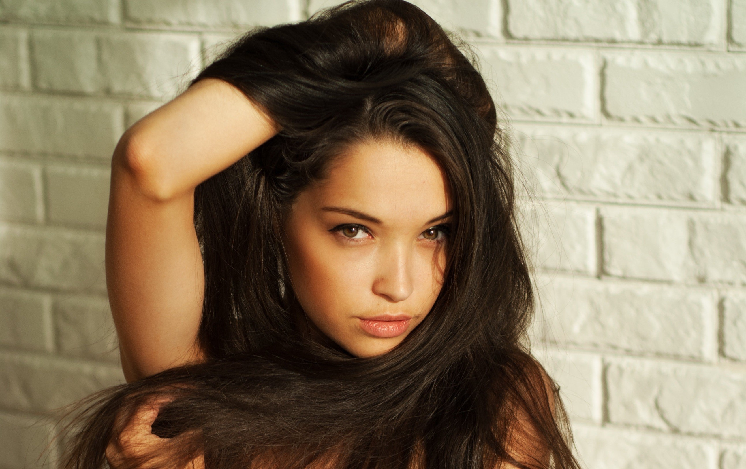 women model brunette long hair face bricks Wallpaper