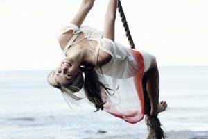 women ropes swings sea upside down barefoot