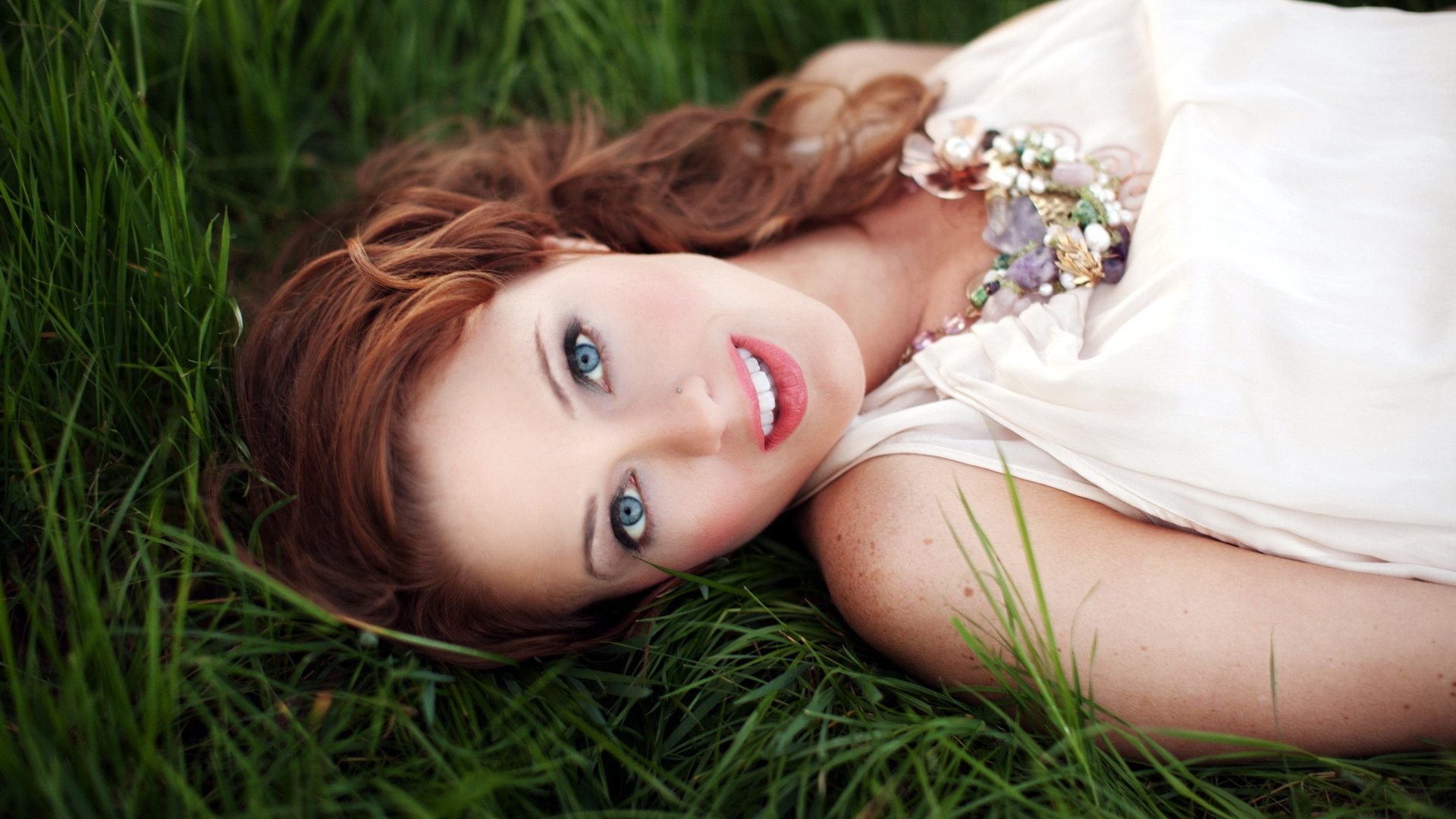 women model long hair women outdoors smiling blue eyes white dress grass redhead pierced nose open mouth Wallpaper