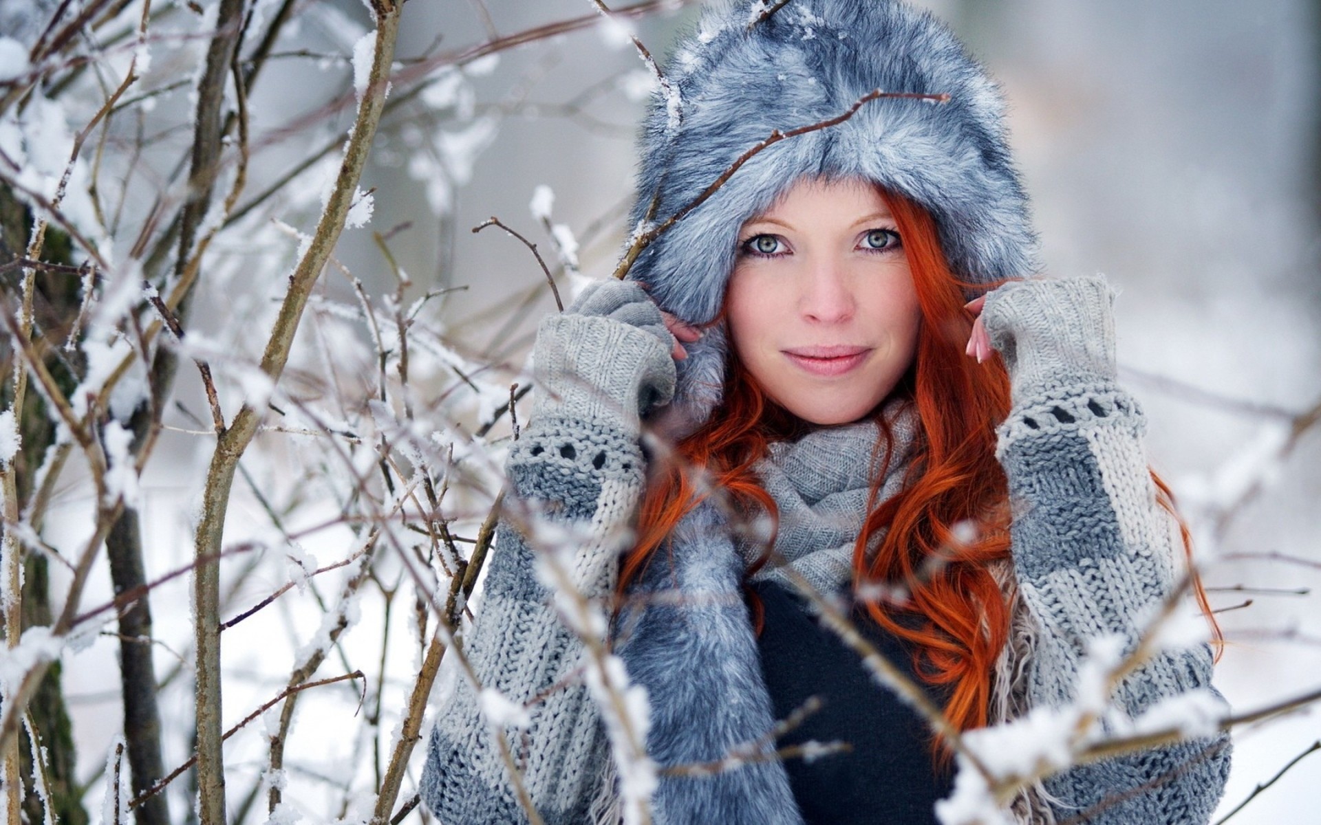 women redhead long hair wavy hair model smiling women outdoors trees sweater blue eyes winter snow furry Wallpaper