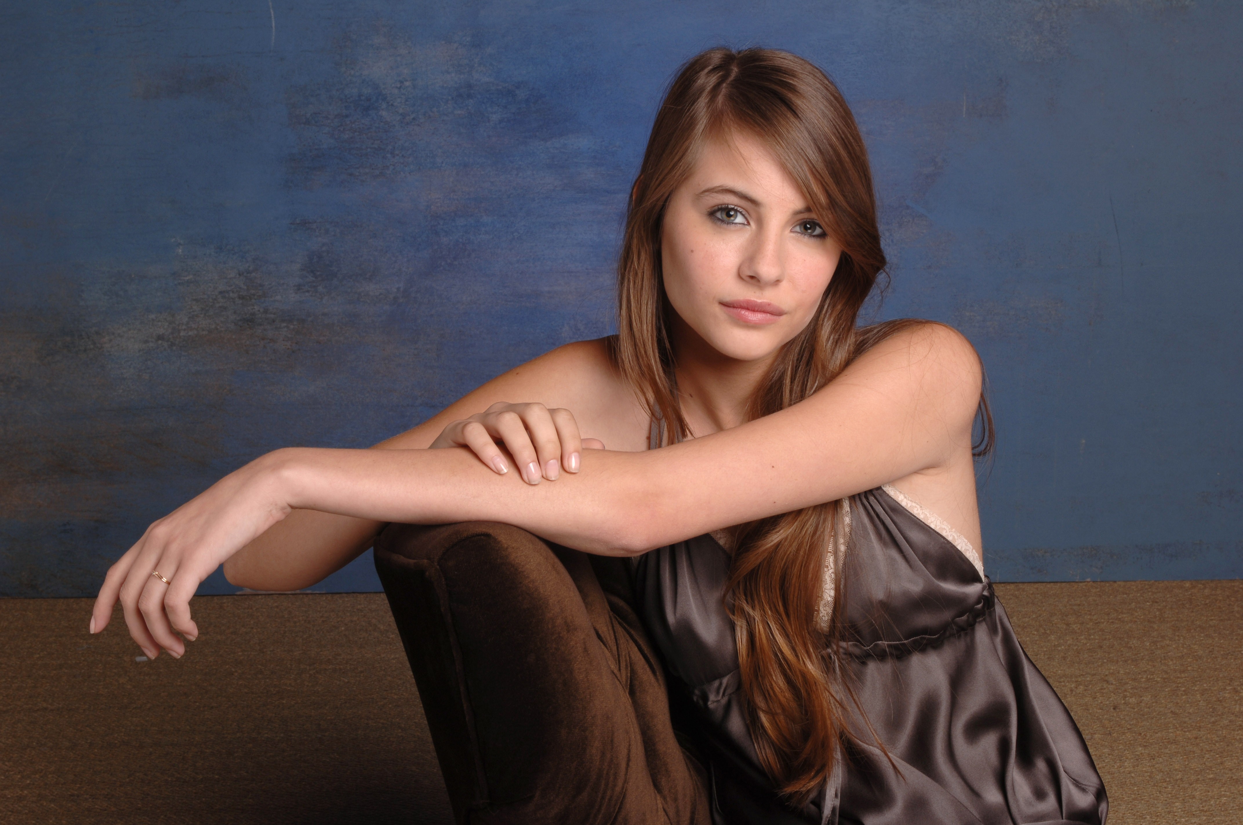 women model brunette long hair willa holland blue eyes dress chair blue background Wallpaper