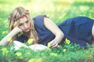 women model long hair women outdoors grass blonde reading flower in hair polka dots blue dress