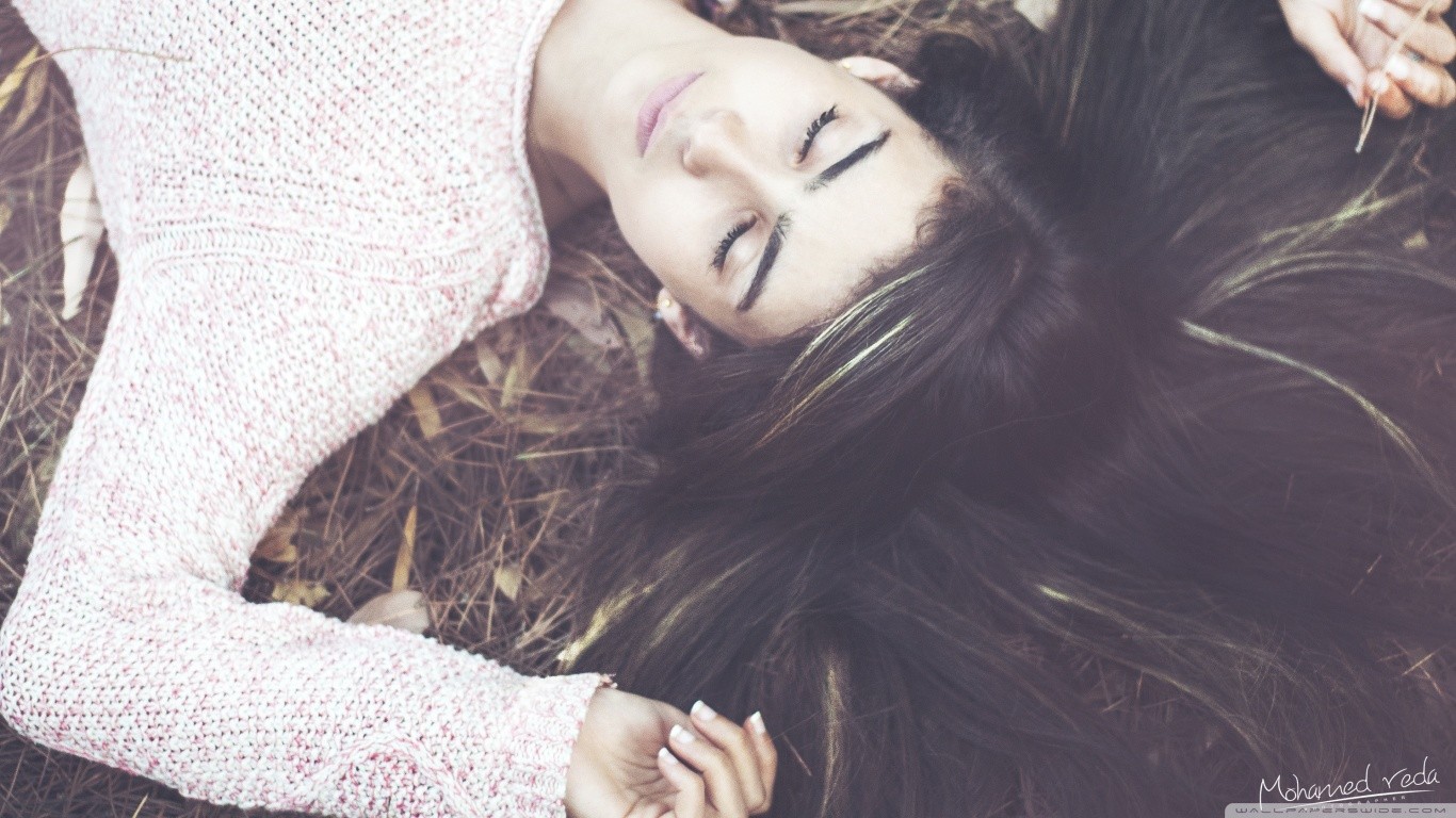 closed eyes women lying down brunette sweater Wallpaper