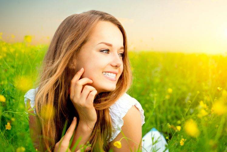 women model long hair face field grass women outdoors blue eyes brunette smiling flowers HD Wallpaper Desktop Background