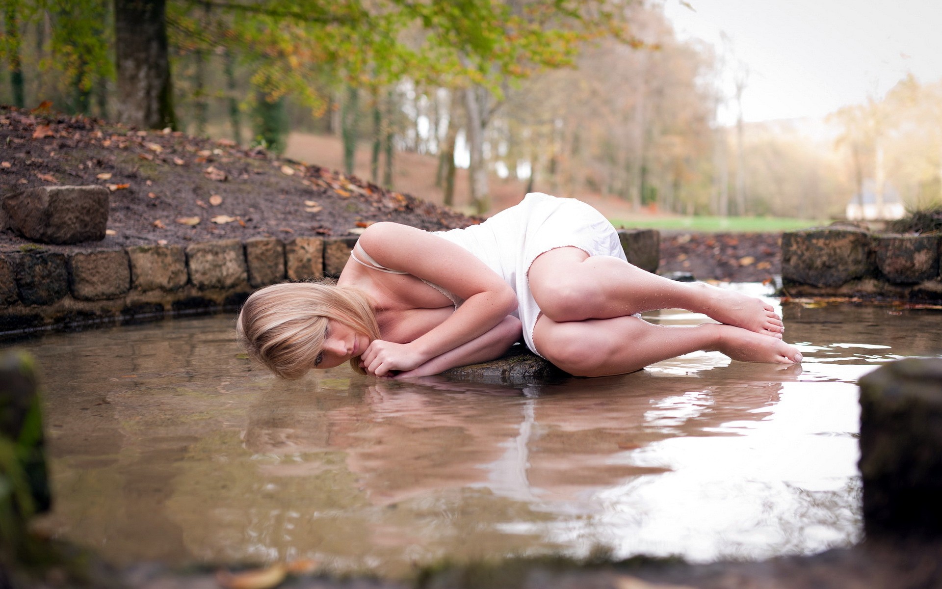 women model blonde long hair white dress barefoot women outdoors water trees Wallpaper