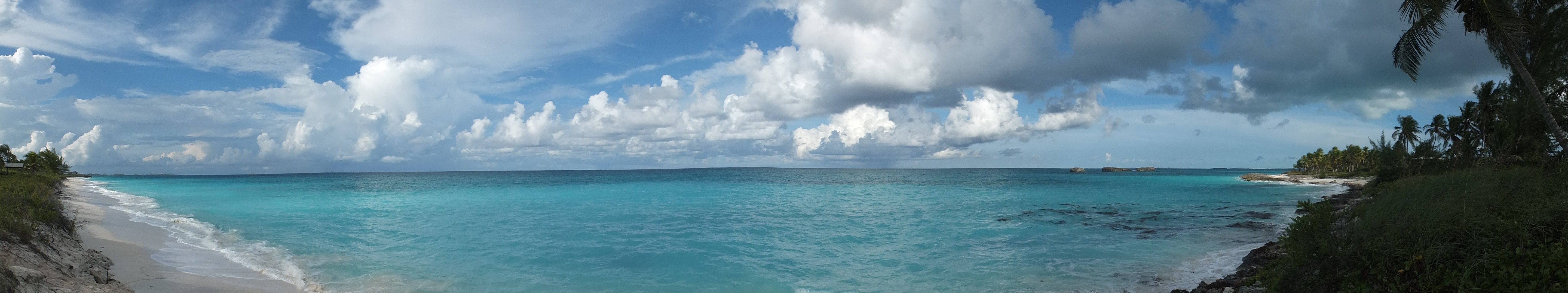 sea, Water, Palm trees, Trees, Grass, Far view, Sky, Clouds, Blue, White, Green, Panorama, Island, Rocks, Shore, Beach, Nature Wallpaper