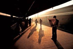 people, Sitting, Steve McCurry, Photography, India, Train, Train station, Newspapers, Reading, Sunset, Sun rays, Waiting, Shadow, Vintage