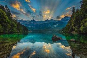 photography, Nature, Landscape, Lake, Calm waters, Sunset, Reflection, Sun rays, Forest, Mountains, Dolomites (mountains), Italy