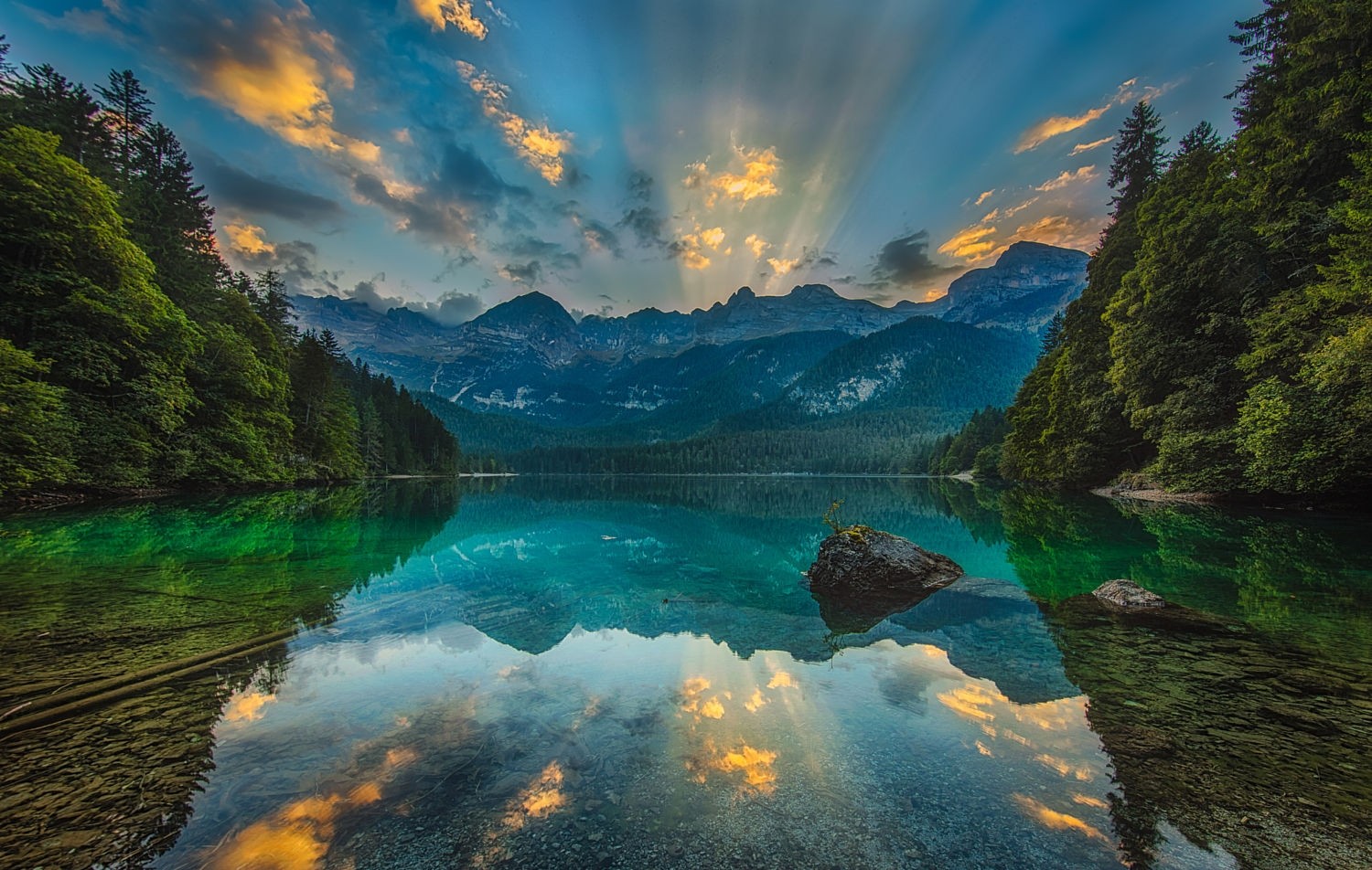 photography, Nature, Landscape, Lake, Calm waters, Sunset, Reflection, Sun rays, Forest, Mountains, Dolomites (mountains), Italy Wallpaper