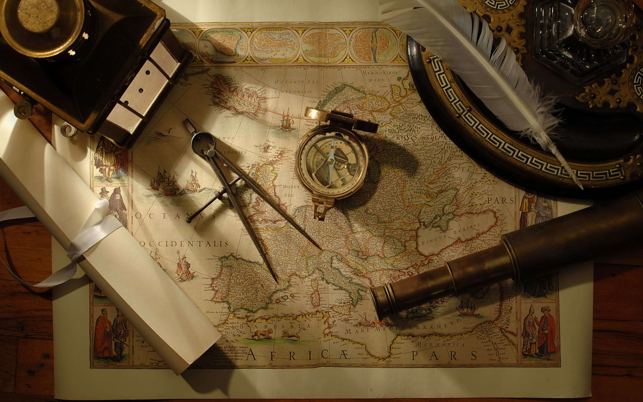 compass, Map, Tools, Feathers, Scrolls, Telescope, Wooden surface Wallpaper