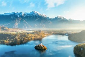 snowy peak, Mountains, Clouds,  dawn, Mist, Hills, Lake, Landscape, Nature, Outdoors, Snow, Reflection, Sunset, Pine trees, Water, Church, Slovenia, Lake Bled
