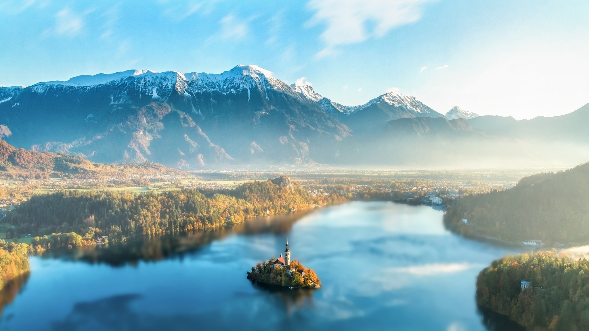 snowy peak, Mountains, Clouds,  dawn, Mist, Hills, Lake, Landscape, Nature, Outdoors, Snow, Reflection, Sunset, Pine trees, Water, Church, Slovenia, Lake Bled Wallpaper