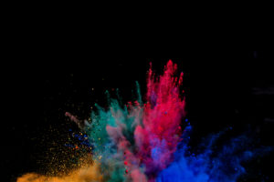 Colored Dust Explosion On Black Background
