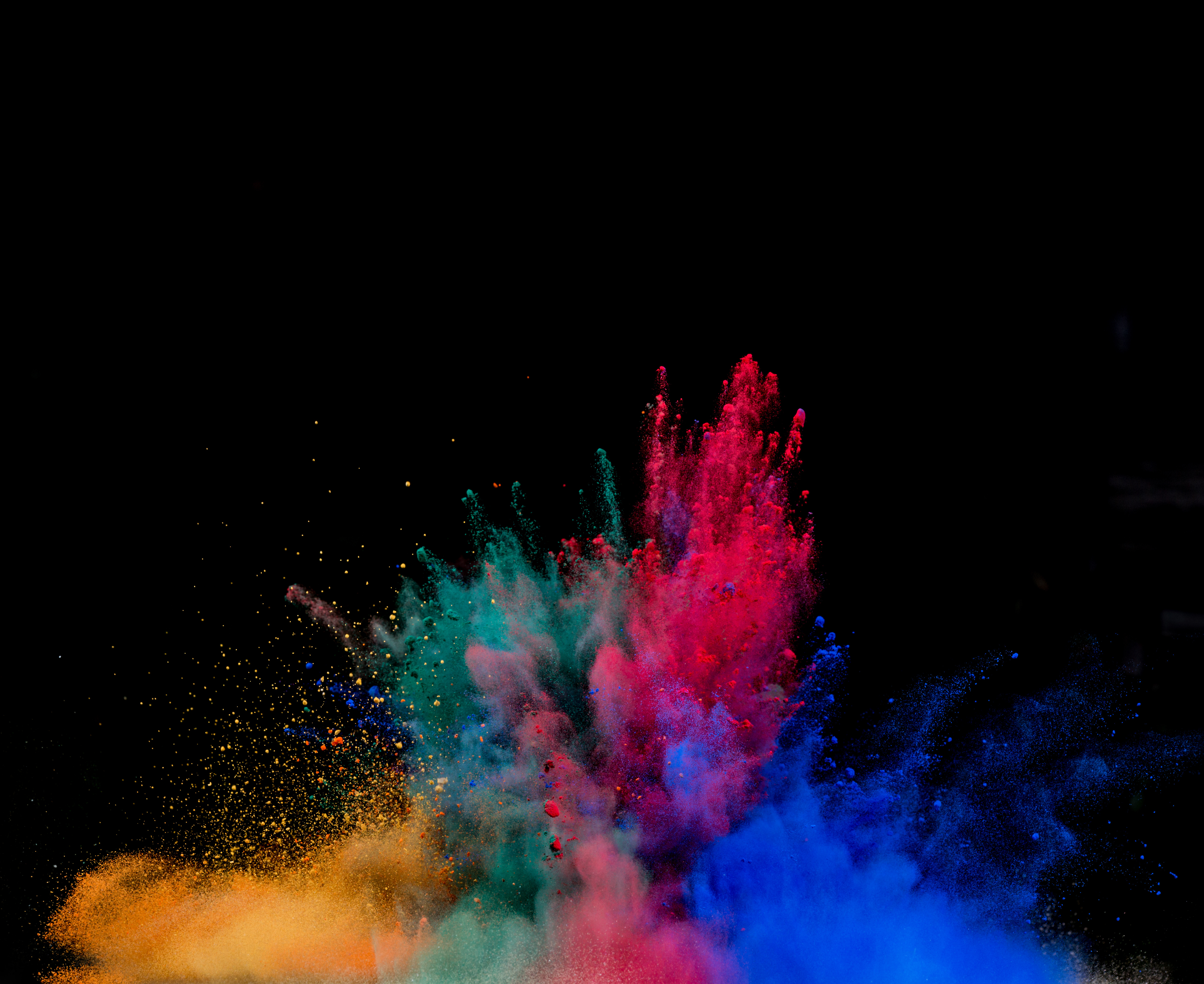 Colored Dust Explosion On Black Background Wallpaper