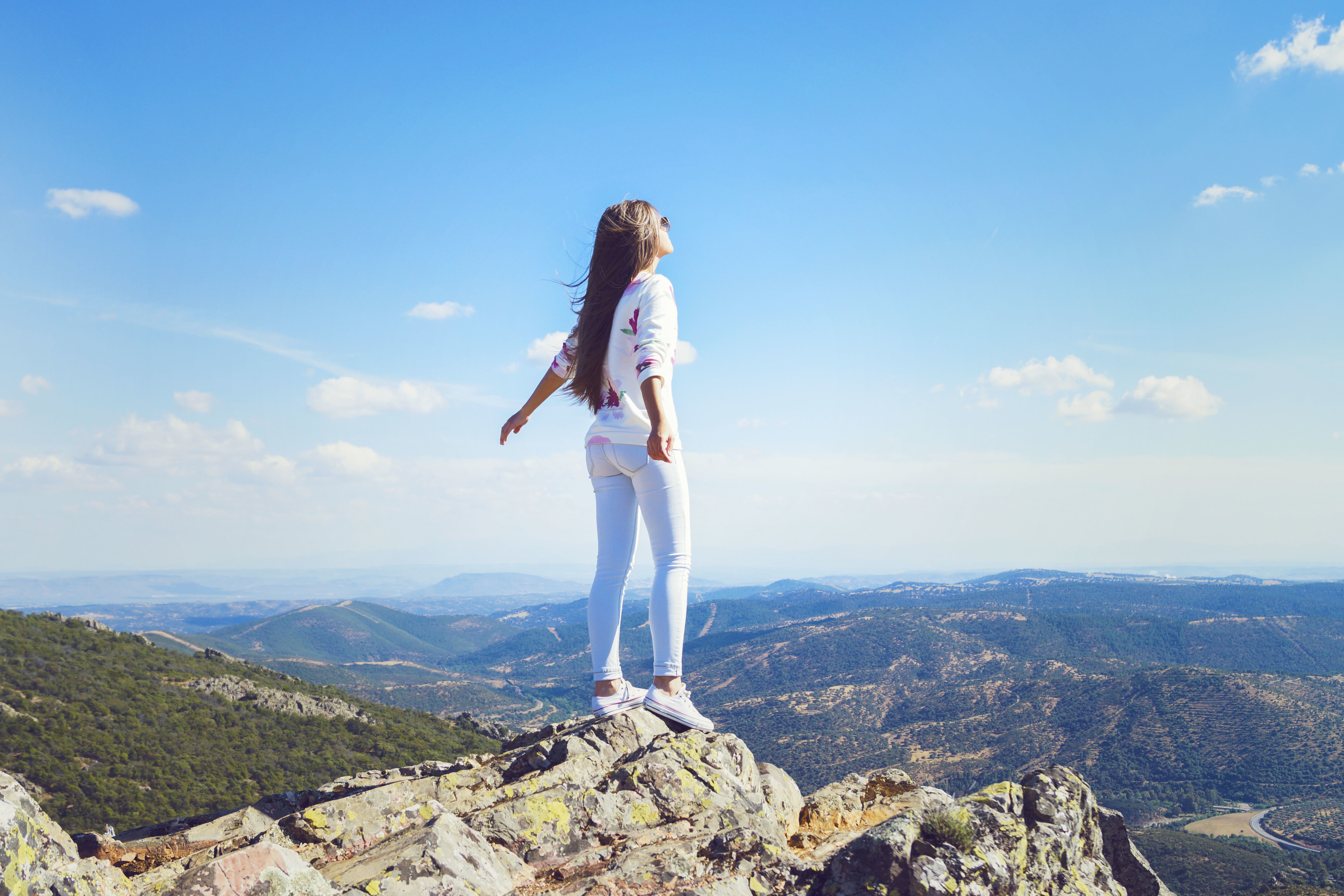 girl, Mountain, Jeans, Wind, Hair, Pose, Standing Wallpaper